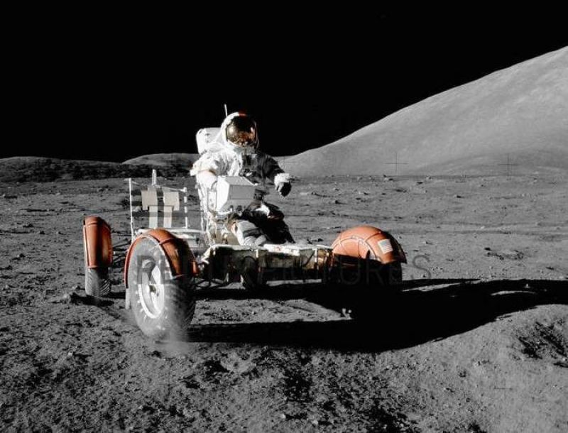 Apollo mission astronaut driving a rover on moon 8 01004383 CROPPED